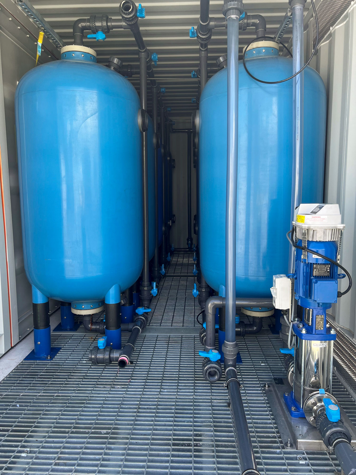 A close up view of the water treatment system on the bunded container floor.