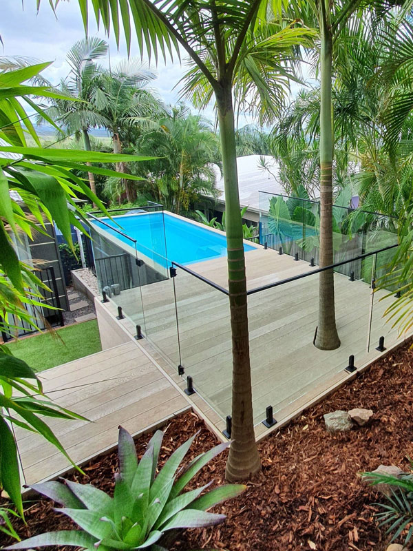 This container pool is hidden discreetly among a tropical garden