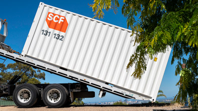 20ft Container being delivered by a tilt tray truck