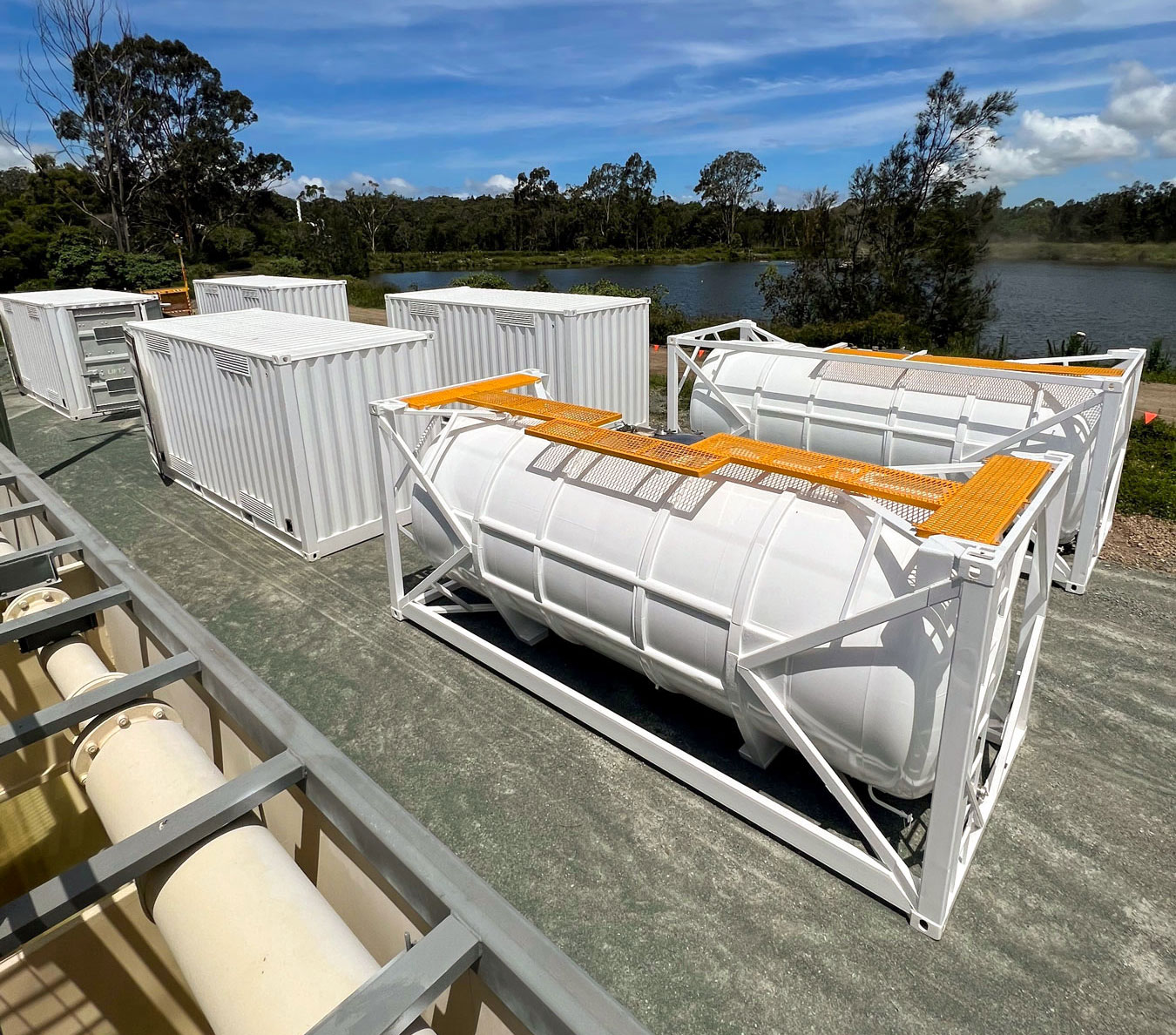 2 x 20ft ISO Tanks sit alongside Dangerous Goods Containers that house chemicals and pumping equipment for the remediation process.