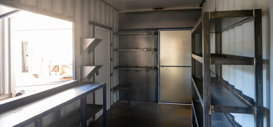 SCF workshed with PA doors, shelving and servery window