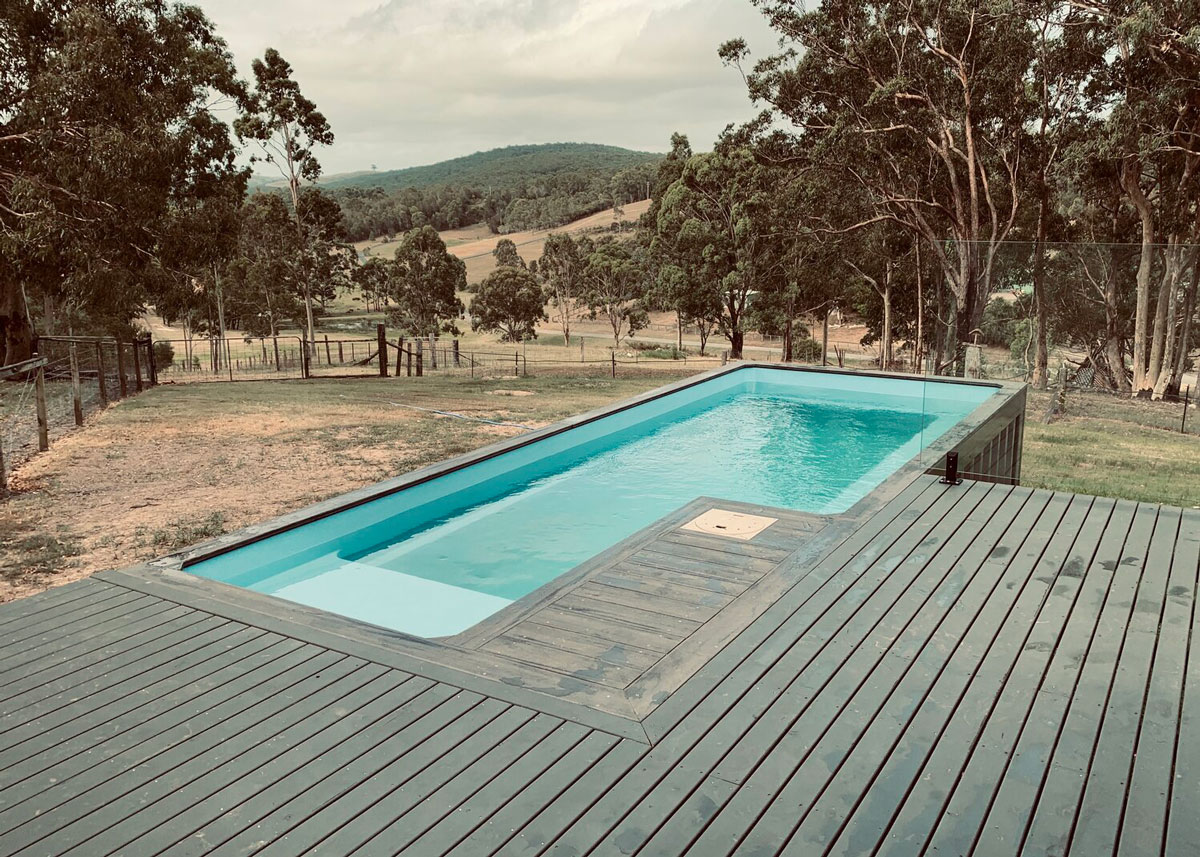 A shipping container converted into a swimming pool